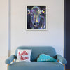 A light blue sofa with hello, love, and dream pillows sits below a colorful cow painting by Artsy Ems Designs—prints available for this vibrant artwork.