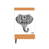 A white vegan notebook from Artsy Ems Designs features tan edges and a detailed black ink illustration of a majestic elephant head on the cover, with a small artist signature in the bottom right corner.
